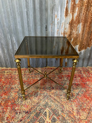 A brass and glass Hollywood Regency side table