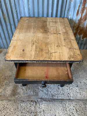 A Victorian scrubbed pine kitchen or dining table with ebonised legs