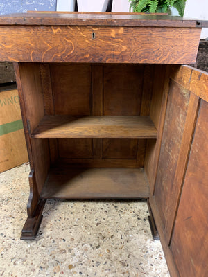 A tall oak clerk's desk