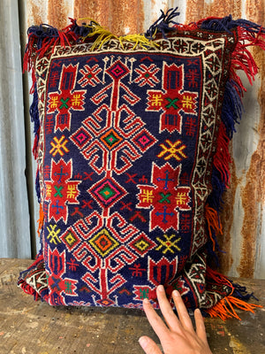 A rectangular red ground Persian carpet floor cushion