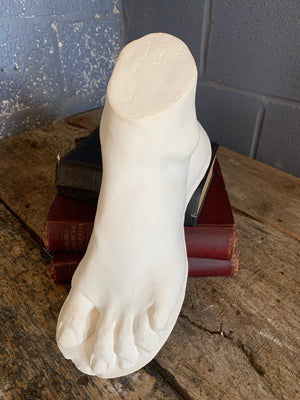 A neoclassical plaster foot of John Tussaud 1873