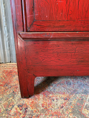 A red lacquered Chinese wedding cabinet