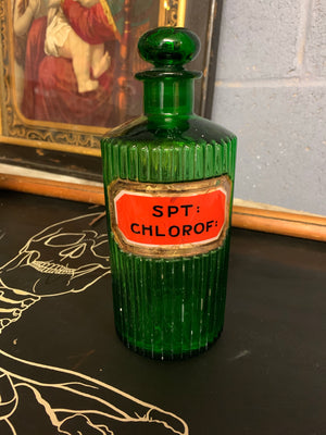 A rare set of three green glass apothecary jars