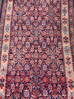 A large Persian blue ground runner - 285 x 116cm