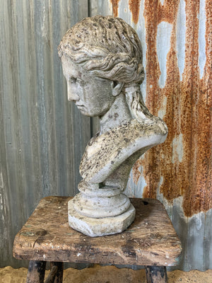 A cast stone classical female bust