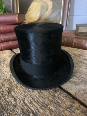 A silk all black top hat by Dunn & Co with its original box