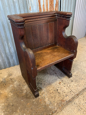 A small wooden 19th century church pew