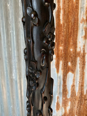 A carved wooden Chinoiserie floor lamp