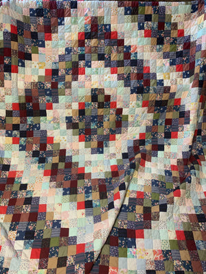 A hand sewn patchwork quilt - large double bed