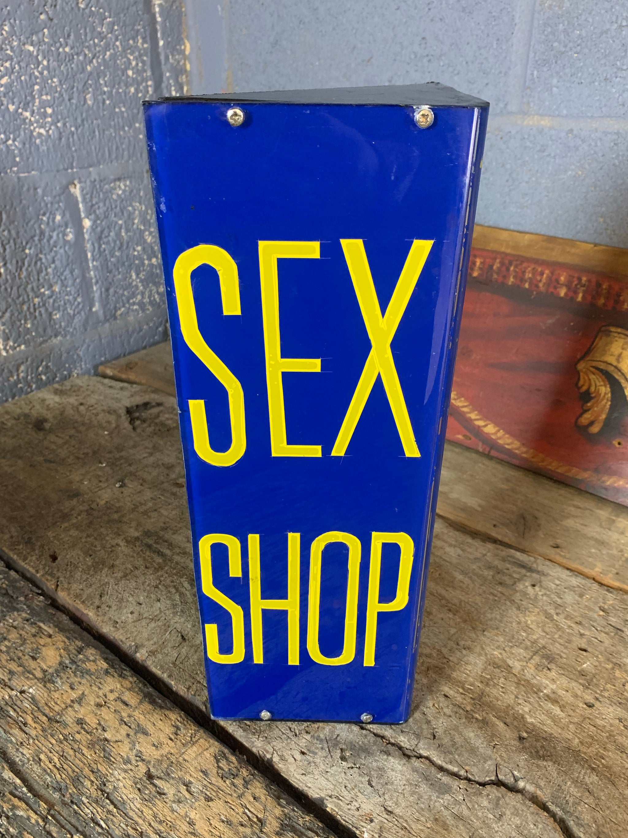 A blue Sex Shop/Girls, Girls, Girls trade sign - Belle and Beast Emporium