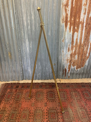 A brass full size floor standing display easel