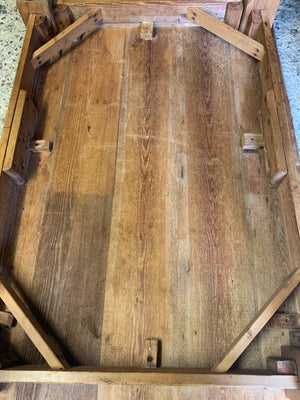 A Victorian scrubbed pine kitchen or dining table on castors