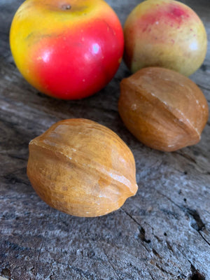 A set of eight hand-painted alabaster fruit and nuts