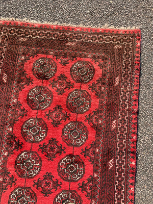 A red ground Bokhara rectangular rug- 180cm x 100cm