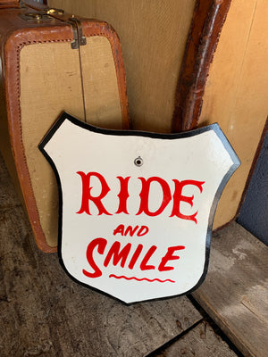 A hand painted fairground advertising sign - Ride and Smile