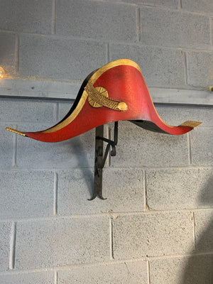 A toleware bicorn hat trade sign