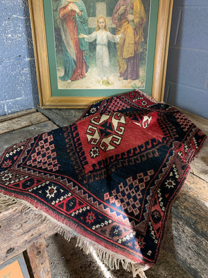 A Persian red & blue ground rectangular rug