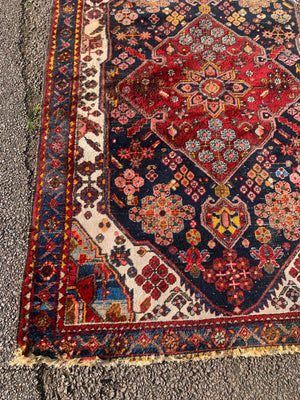 A Persian floral patterned rectangular rug