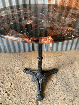 A black cast iron bistro table with red Palladion granite top - small (two available)