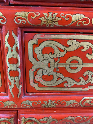 A red and gold lacquer Chinoiserie cabinet