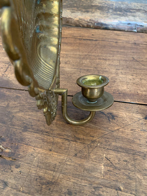 A pair of large brass shell candlestick wall sconces