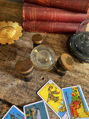 An unusual fortune teller's crystal ball on a brass and horn stand
