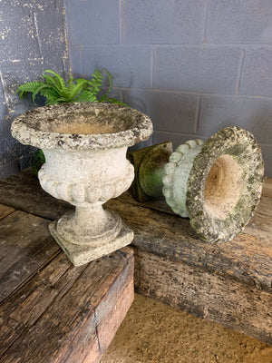 A pair of large white stone urns