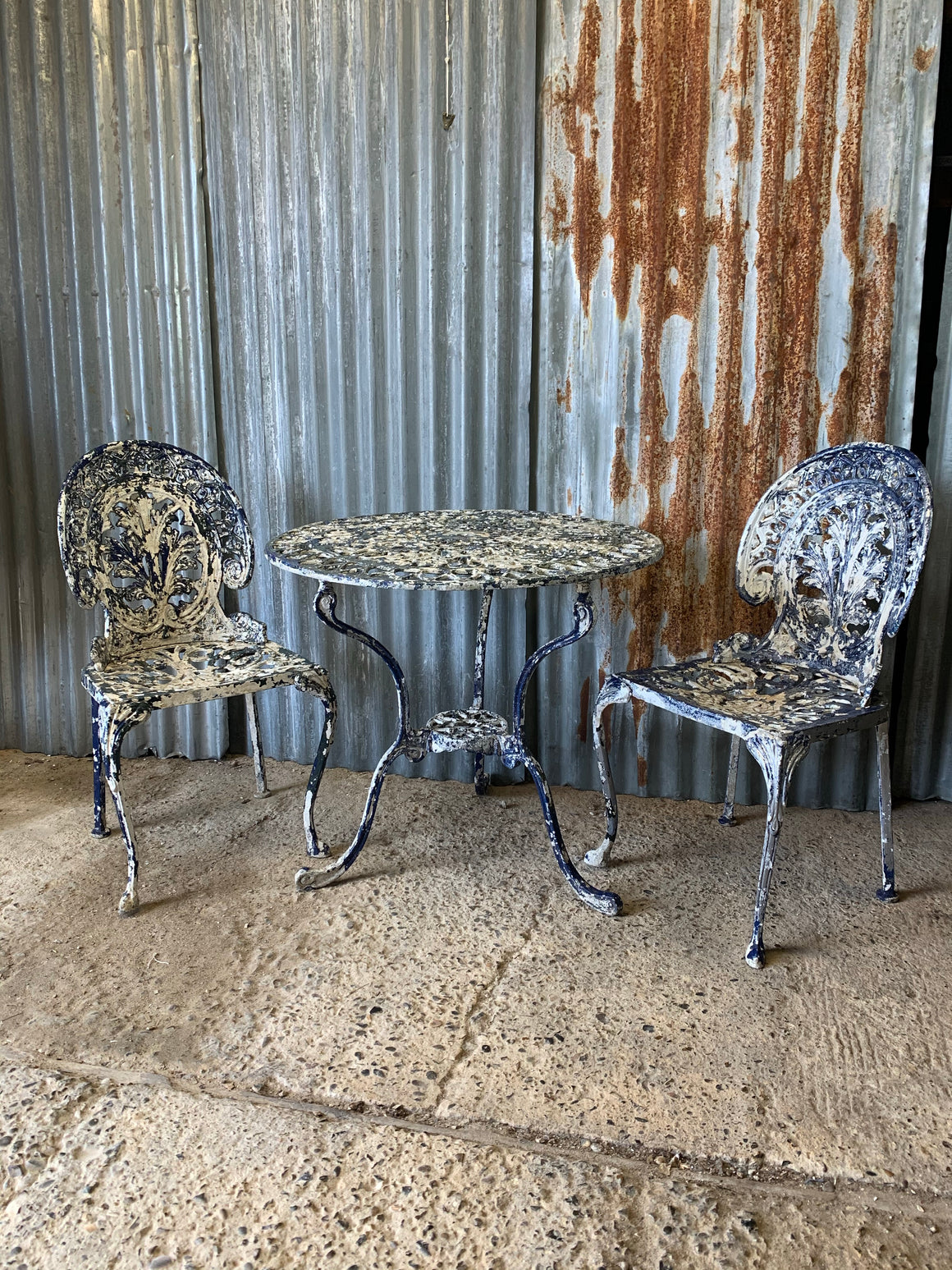 A blue and white garden table and chairs set
