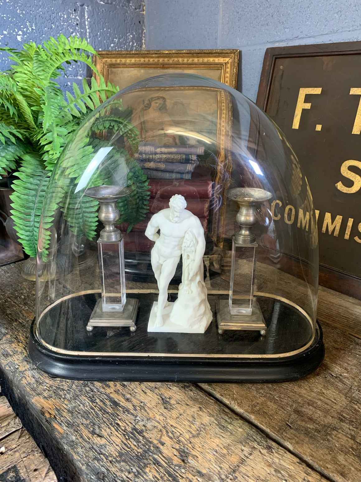 A 19th Century lollipop dome on an ebonised wooden base