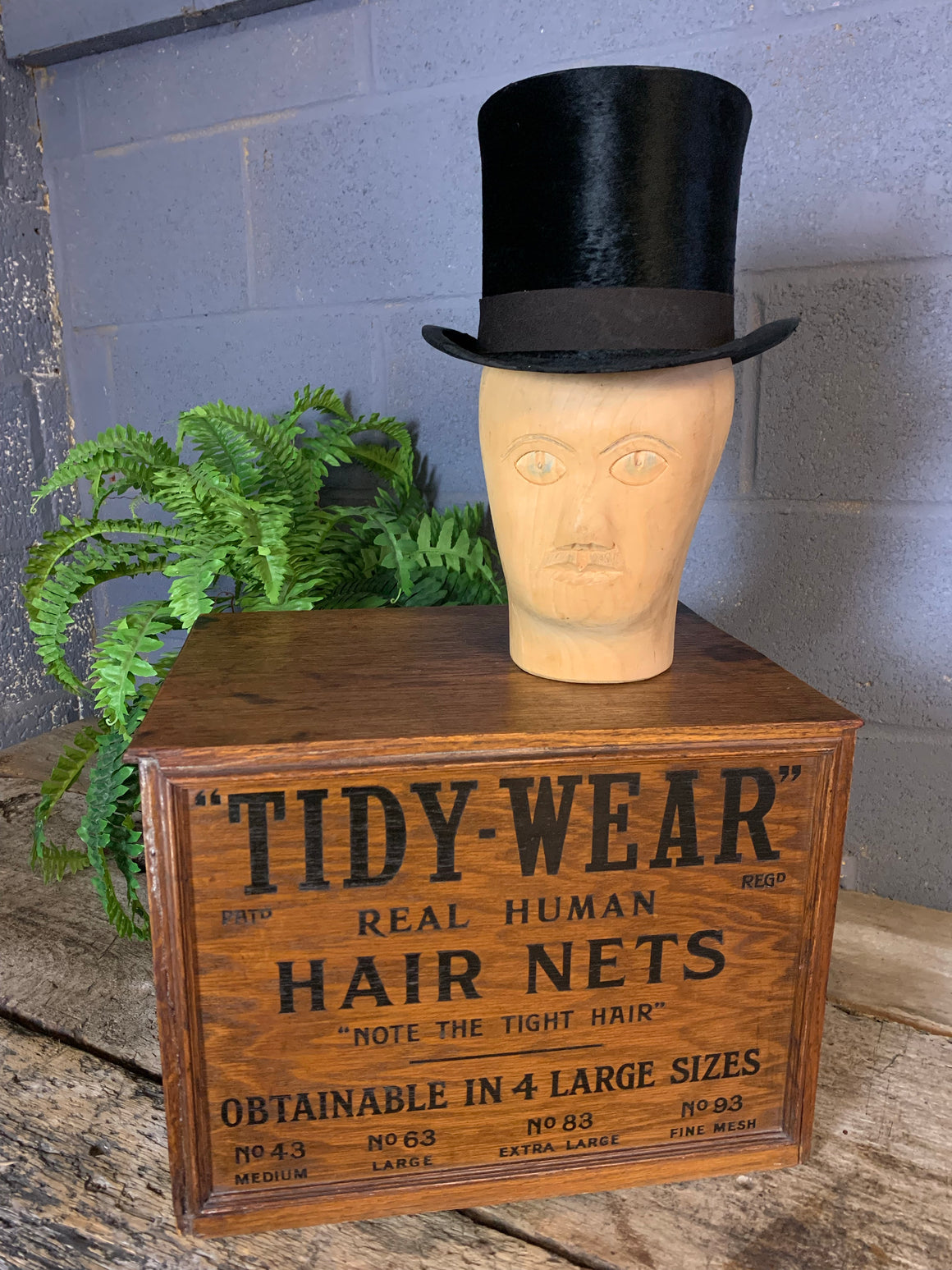 A bank of advertising drawers for Tidy Wear Human Hair Nets