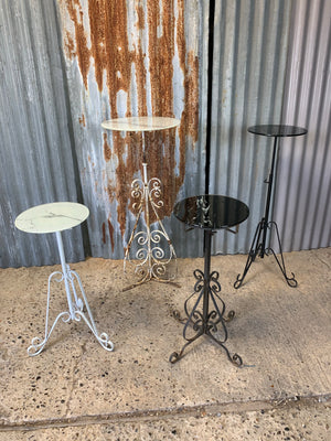 A white metal garden wine table or stand