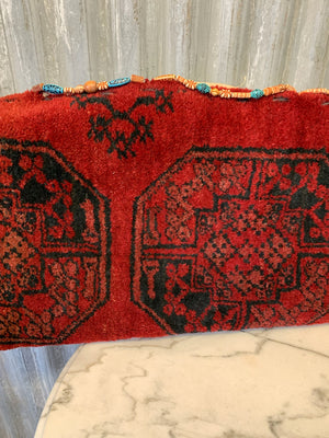 A very large red ground Persian carpet cushion