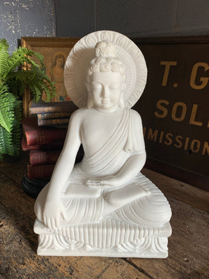 A large bonded marble Buddha statue