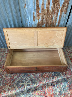 A pine under bed storage box on original castors