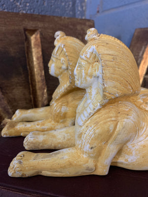 A pair a plaster sphinxes