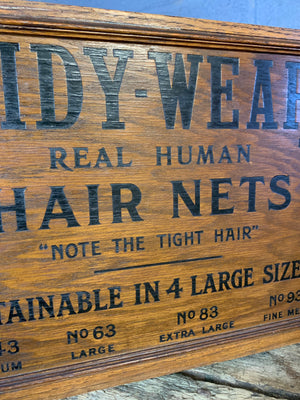 A bank of advertising drawers for Tidy Wear Human Hair Nets