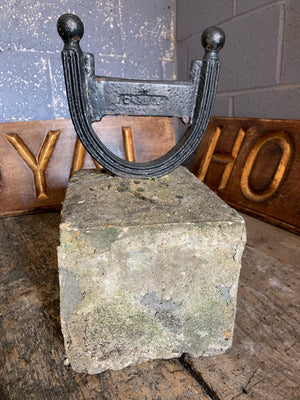 A large stone and cast iron boot scraper by Carron