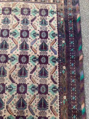 A hand woven Persian purple & turquoise ground rectangular rug