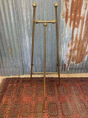 A brass full size floor standing display easel