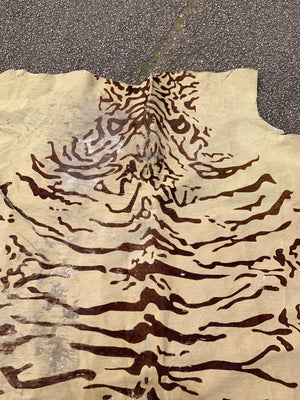 A cowhide rug with Bengal tiger stripe patterning