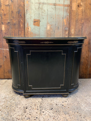 An ebonised credenza with mirrored top