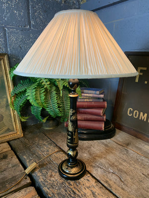 A black Chinoiserie table lamp