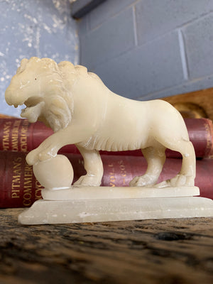 An opposing pair of Grand Tour alabaster Medici lions