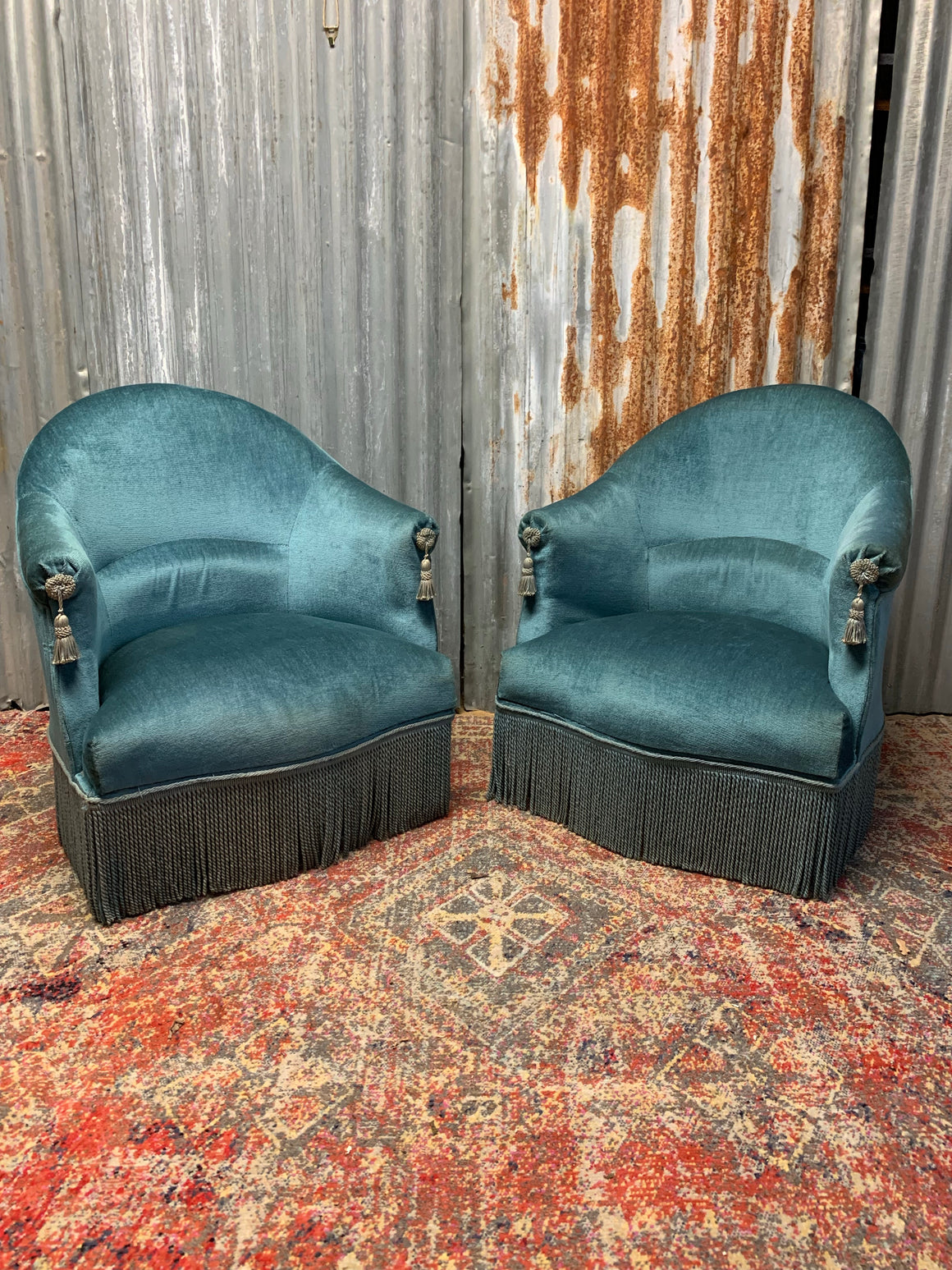 A pair of blue French chairs