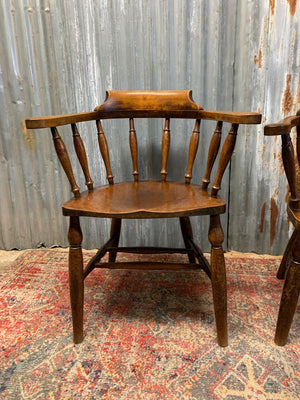 A pair of bow back captain's chairs