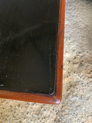 A Victorian single drawer table with ebonised top and glass handles