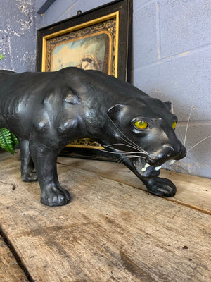 A very large mid century black leather panther (83cm)