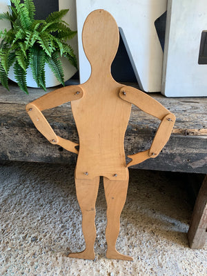A wooden 2D flat female mannequin cut out