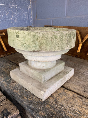 A cast stone font bird bath