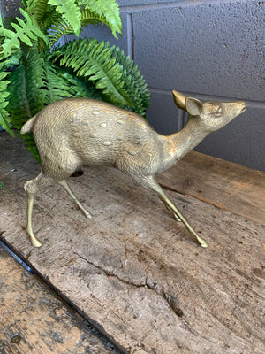A large brass Mid-Century Hollywood Regency fawn statue